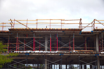 building under construction residential development metal beams structure