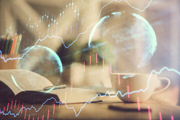 Multi exposure of forex graph drawing and desktop with coffee and items on table background. Concept of financial market trading