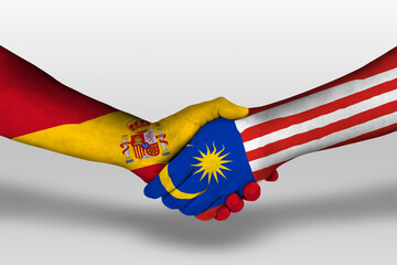 Handshake between malaysia and spain flags painted on hands, illustration with clipping path.