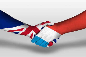 Handshake between luxembourg and united kingdom flags painted on hands, illustration with clipping...