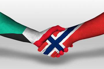 Handshake between norway and kuwait flags painted on hands, illustration with clipping path.