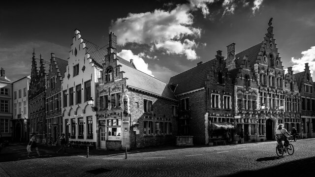 Brugge / Belgium - Sept. 18, 2018: Black and White Photo of Medieval houses with step gables along the cobblestone streets of the historic city of Bruges, Belgium
