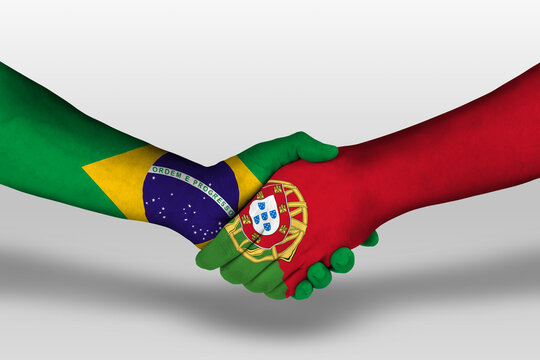 Handshake between portugal and brazil flags painted on hands, illustration with clipping path.