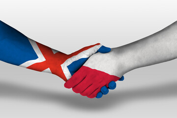 Handshake between poland and iceland flags painted on hands, illustration with clipping path.
