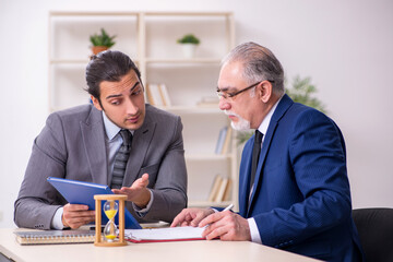 Two businessmen in time management concept