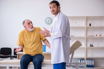 Old patient visiting young male doctor