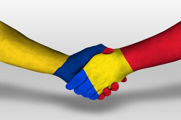 Handshake between romania and columbia flags painted on hands, illustration with clipping path.
