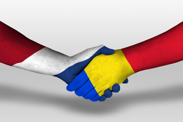 Handshake between romania and netherlands flags painted on hands, illustration with clipping path.