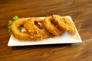 Onions fried on a wooden table