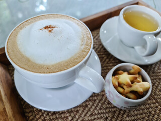 Top view of  hot coffee in white cup