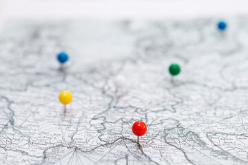 White and black map with colorful stickpins