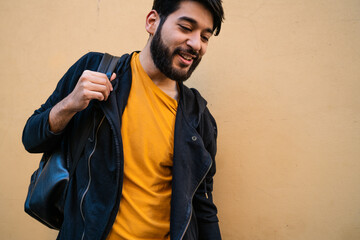 Beared man with backpack on his shoulders.