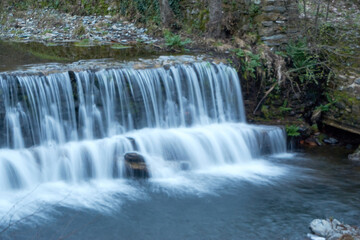 Fototapeta na wymiar waterfall in the forest silk effect river