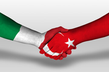 Handshake between turkey and italy flags painted on hands, illustration with clipping path.