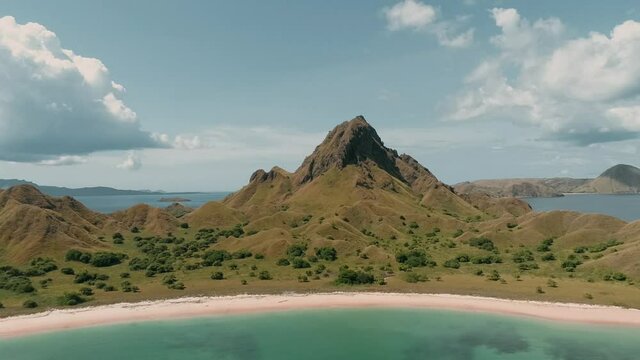 Padar island.pink beach.Wild islands of Indonesia. Flores. tropical paradise. Labuan Baggio. drone shooting. Wild beaches, blue logons, coral reefs, green hills. aerial view. boat trip safari. 