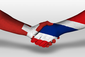 Handshake between thailand and switzerland flags painted on hands, illustration with clipping path.