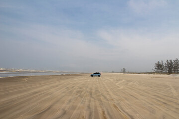 Fototapeta na wymiar car on the beach