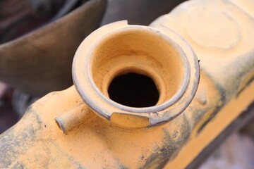 Close up old radiator cap under the hood of the car