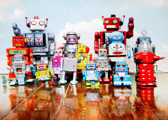 a large group of retro tin robot toys on a old wooden floor