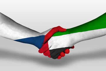 Handshake between united arab emirates and czech republic flags painted on hands, illustration with...