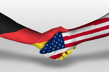 Handshake between united states of america and germany flags painted on hands, illustration with...