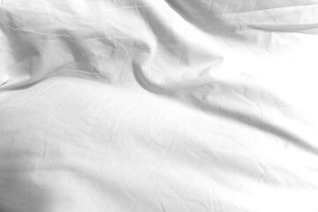The surface wrinkles of the white bedding in the hotel.