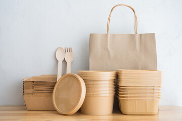 Natural eco-friendly disposable utensils (fork, spoon, bag, food box container, bowl) made of fiber...