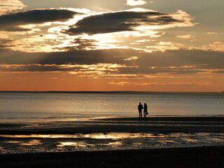 Fototapeta na wymiar Sunset on the beach of the Sestroretsk resort, coast of the Gulf of Finland, St. Petersburg, Russia.