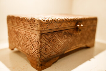 Old wooden casket with graved flower pattern