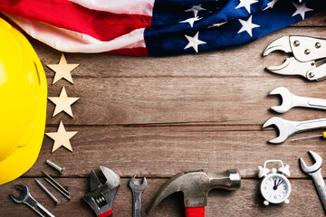 USA Labor day concept, Top view flat lay of different kinds wrenches with American flag on wood...