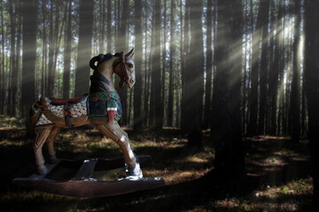 Rocking horse in a pine forest