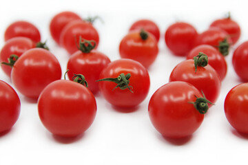 Cherry tomatoes isolated on a white background. Red tomatoes on a twig