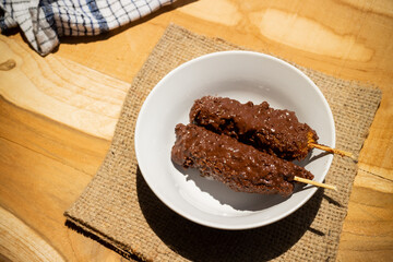 Banana coasted by chocolate which is very sweet