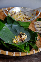 doing Vietnamese vegetarian dish, make deep fried corn  spring roll, vegan food in leaf background