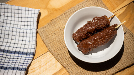 Banana coasted by chocolate which is very sweet