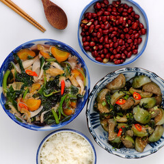 vegan daily meal for lunch time, fried peanut with sauce, fried green round eggplant, rice bowl, vegetables soup, simple vegetarian Vietnamese food