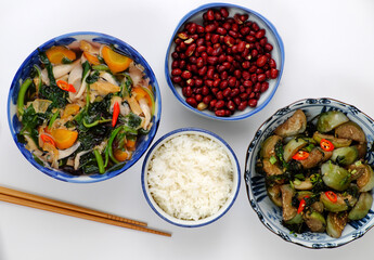 vegan daily meal for lunch time, fried peanut with sauce, fried green round eggplant, rice bowl, vegetables soup, simple vegetarian Vietnamese food
