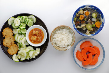 vegan daily meal for lunch, cucumber slice with tofu cheese, seaweed soup, rice bowl, simple vegetarian Vietnamese food