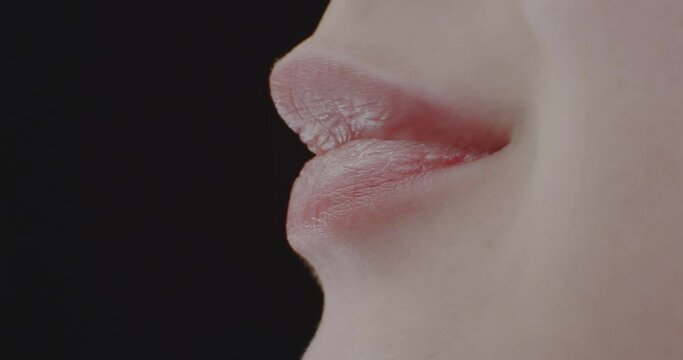 Macro. Eating Girl with Braces. Lips