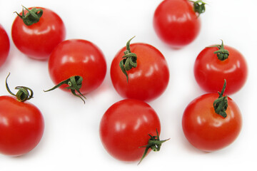 Cherry tomatoes isolated on a white background. Red tomatoes on a twig