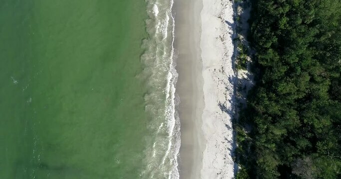 White sandy Myola Kite beach on Jervis bay in aerial top down flying as 4k.
