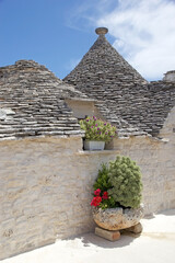 Trulli along the street at Alberobello, Apulia, Italy