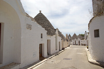 Trulli along the street at Alberobello, Apulia, Italy