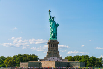 Fototapeta na wymiar The statue of Liberty with blue sky background.