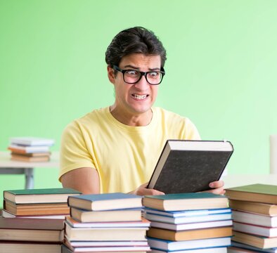 Student with too many books to read before exam