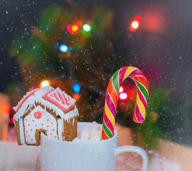 Christmas gingerbread handmade decorated with patterns and covered with icing. Cozy atmosphere. New year's eve concept.