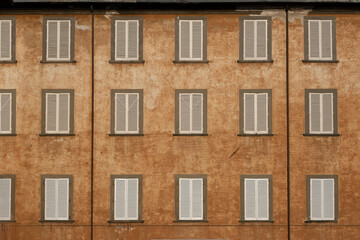 Facade of a Old Building with Windows in a Medieval Town of Tuscany