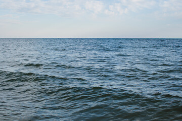 sea water on the shore and clear sky