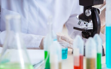Fototapeta premium Woman chemist working in hospital clinic lab