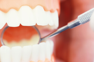 Dentist's office. Dentist examines the oral cavity before treatment. The doctor shows a course of treatment. Caries jaw treatment. Implantation and installation of veneers.